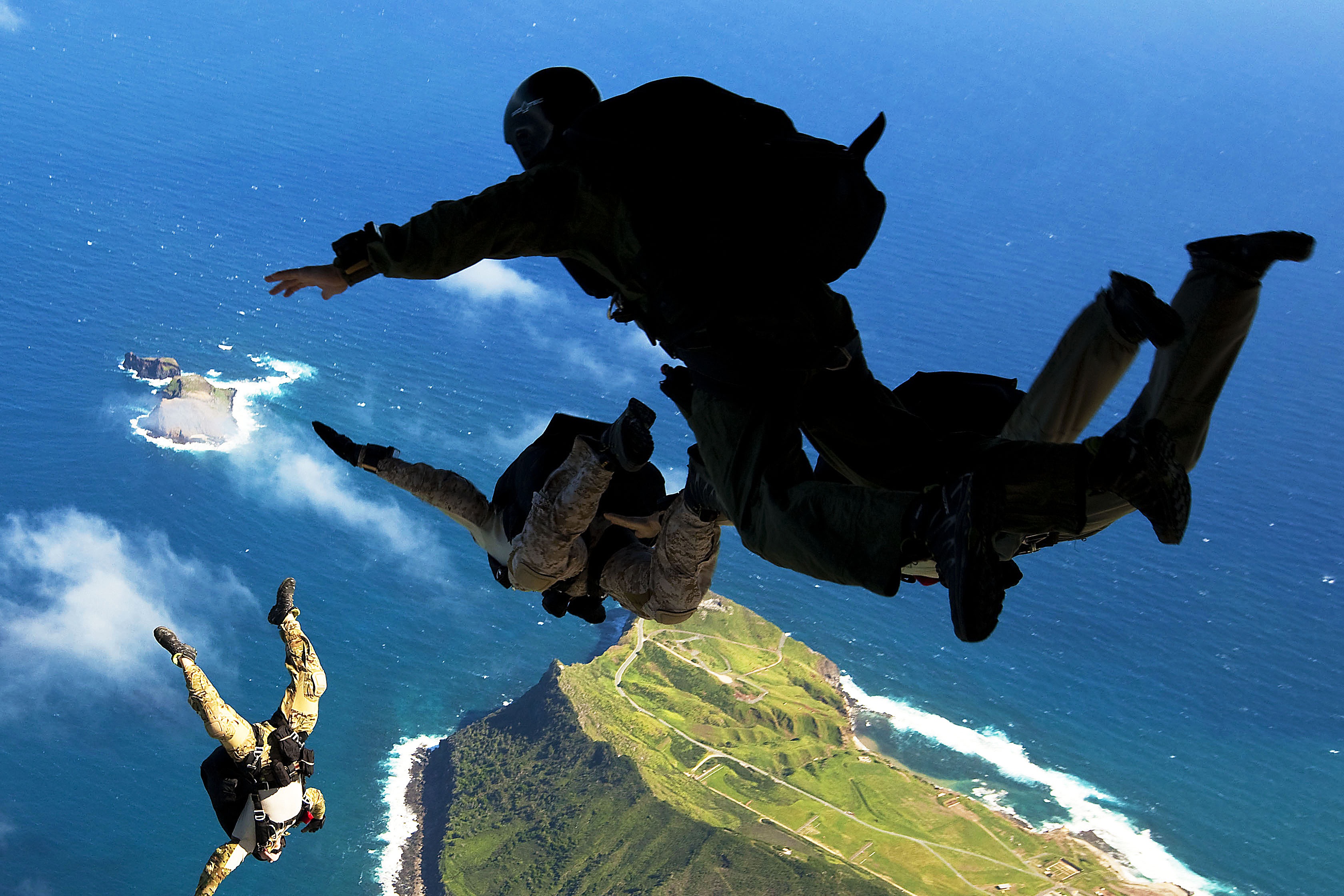 Army paratroopers jumping out of a plane